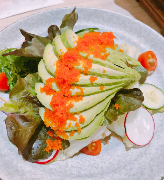 istock Vegetable salad served with sliced avocado and shrimp eggs. 1003416044