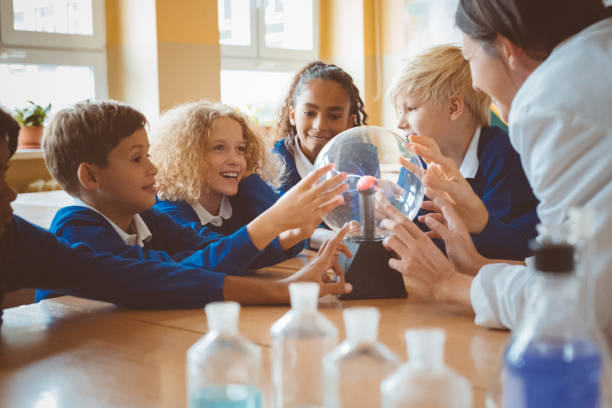 istock Female teacher showing plasma ball during lesson at school 1003416576