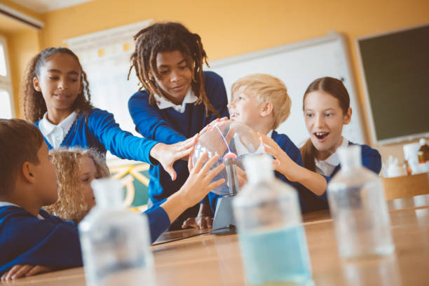 istock School kids touching plasma ball during physics lesson at school 1003416784