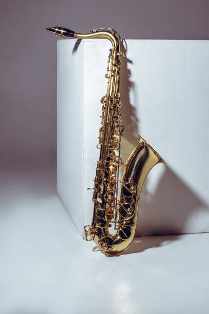 istock close-up view of single shiny professional saxophone on grey 1003417104