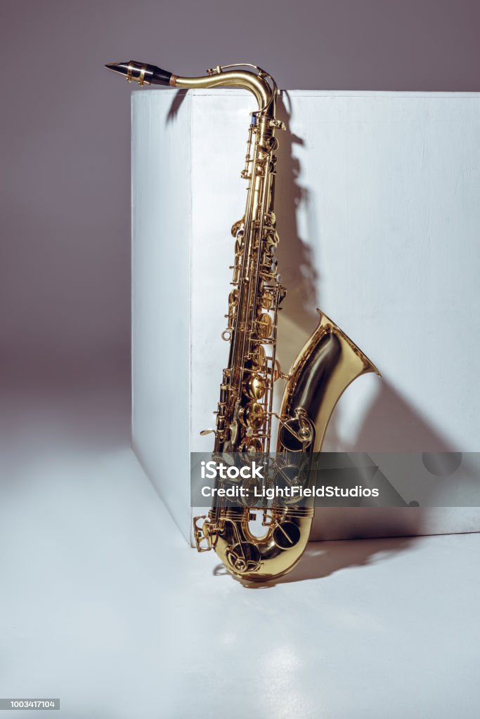 Saxop Closeup View Of Single Shiny Professional Saxophone On Grey Stock Photo ...
