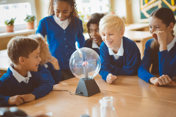 istock School kids watching plasma ball during physics lesson at school 1003417526