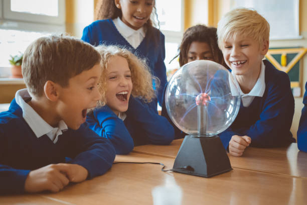 istock School kids watching plasma ball during physics lesson at school 1003417582