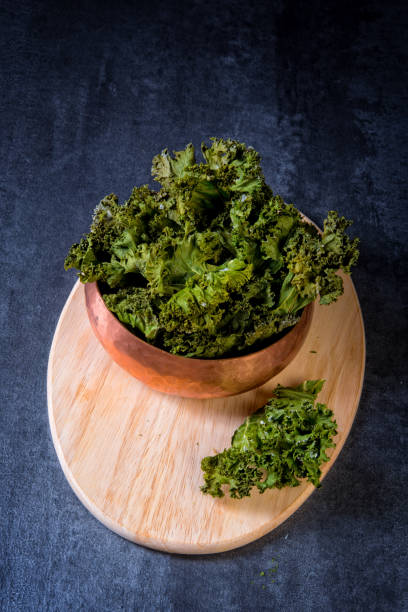 istock Vegan kale chips with sea salt 1003420788