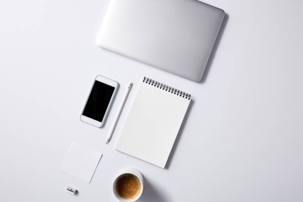 istock top view of arranged various business workplace objects on white tabletop for mockup 1003422884