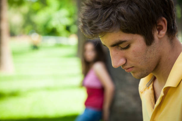 istock Young romantic couple together outside 1003426054