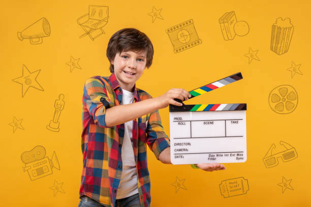 Happy boy feeling good while shooting his first film