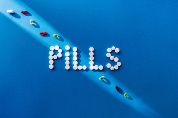 istock top view of lettering pills by white tablets on blue background with sunlight 1003454980