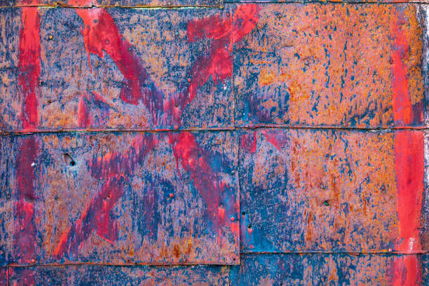 Background. The texture of the old rusty metal plate with cracks and rivets