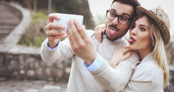 istock Couple in love taking selfies while traveling 1003480304