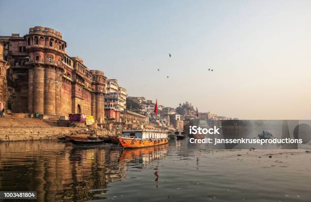 Life Along The Ganges Riverpilgrims Bath And Pray People Walkwashes And Dry Laundrytourists Take Boat To Sea Old Temples And Ghats From The River Stock Photo - Download Image Now