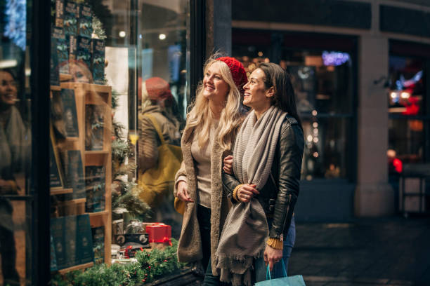 istock Two Friends Christmas Shopping 1003489762