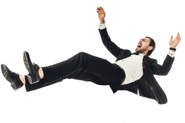 istock scared young businessman in suit falling isolated on white 1003490484