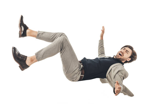 istock shouting young businessman in suit falling isolated on white 1003490568