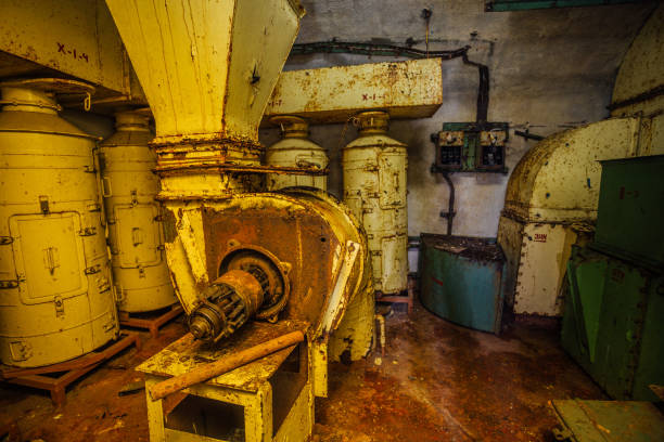 istock Old rusty air filtration and ventilation system in abandoned Soviet bunker 1003494894