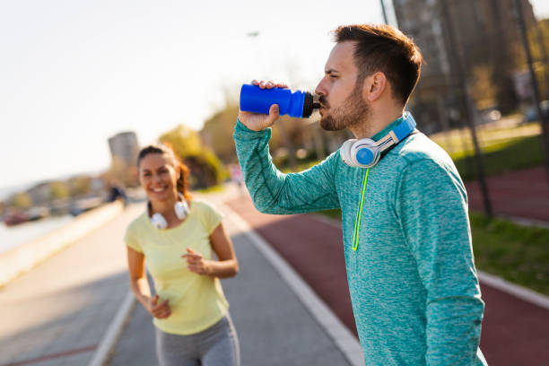 istock Beautiful couple jogging in nature 1003495008