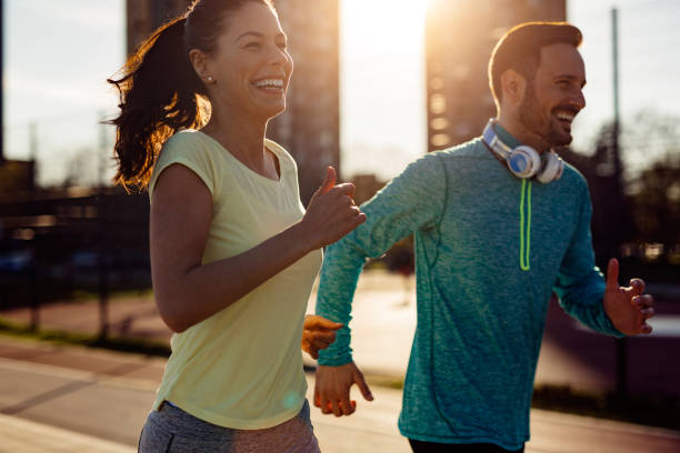 istock Beautiful couple jogging in nature 1003496176