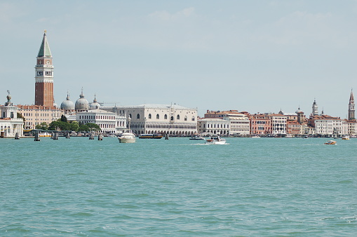 Venice (Italian: Venezia) is a city in northeastern Italy and the capital of the Veneto region. It is built on a group of 118 small islands that are separated by expanses of open water and by canals; portions of the city are linked by over 400 bridges. The islands are in the shallow Venetian Lagoon, an enclosed bay lying between the mouths of the Po and the Piave rivers (more exactly between the Brenta and the Sile).\n\nSanta Maria della Salute (English: Saint Mary of Health), commonly known simply as the Salute, is a Roman Catholic church and minor basilica located at Punta della Dogana in the Dorsoduro sestiere of the city of Venice, Italy.