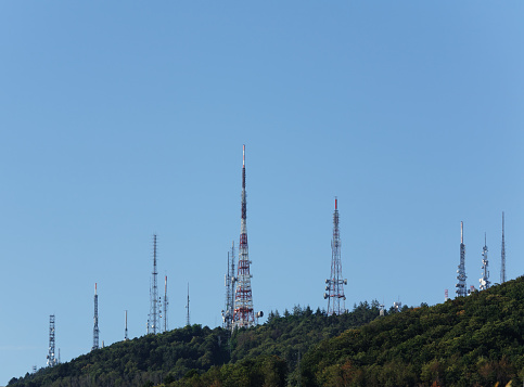 several communication towers on top ot mountain. Tuscany, Italy