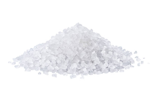 istock heap of salt isolated on white background. 1003535168