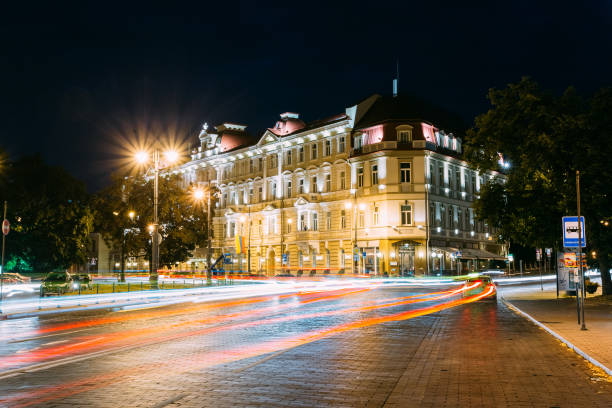 istock Vilnius Lithuania. Kempinski Hotel Cathedral Square In Bright Night Illumination Universiteto Street 1003538812