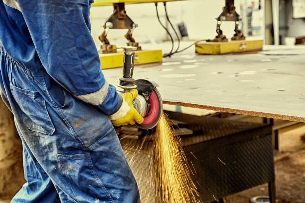 istock Industrial worker cutting steel with working tool 1003539670