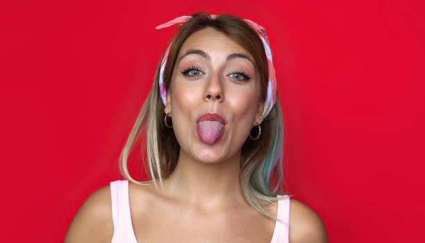 istock Different faces of a woman - Red background 1003542810