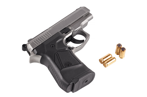 pistol with traumatic ammunition, isolated on white background