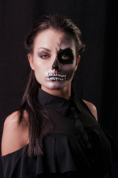 istock Beautiful woman with make-up skeleton 1003560456