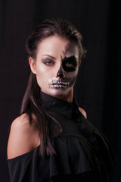 istock Beautiful woman with make-up skeleton 1003560478