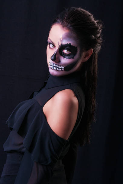 istock Beautiful woman with make-up skeleton 1003560504