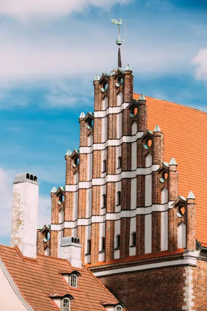 Photo of Riga, Latvia. Facade Of Old Medieval House In Summer Sunny Day Under Blue Sky