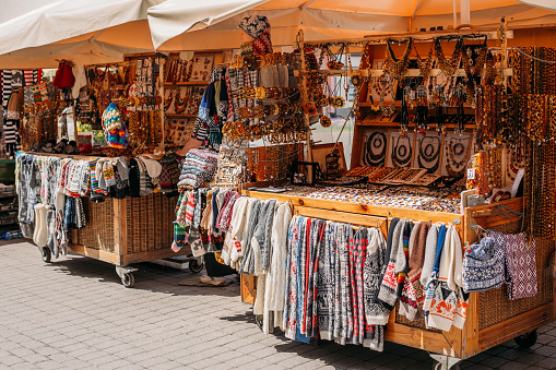Riga, Latvia. Street Market In Livu Square. Trading Houses With Sale Of Gifts, Sweets And Souvenirs Made From Wood And Amber.