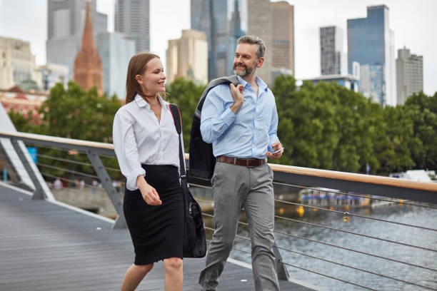 istock Business people commuting on bridge in city 1003562296