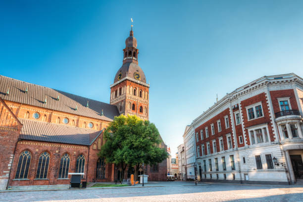 istock Riga, Latvia. Dome Cathedral In Sunny Evening Light Under Blue Sky. Ancient Medieval Monument Of Old Town, Architectural Heritage, Famous Landmark. 1003562618