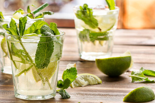 istock mojito cocktail with rum, lime and soda, garnished with mint 1003565078