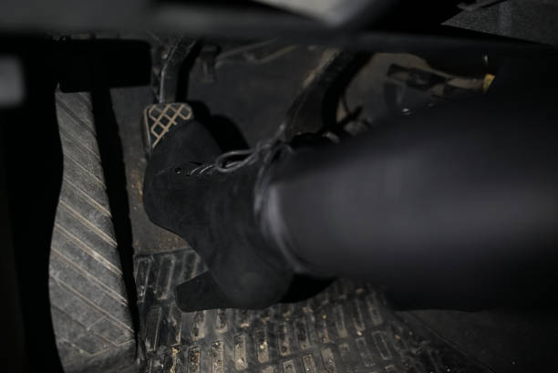 istock Sexy Feet on Car Pedal 1003565570