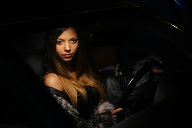 istock Glam Lady in a Car 1003566140