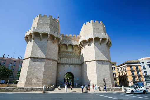 Exterior facade of the monumental Serrano gate or Serrans Gate, built in the 14th century, in the center of Valencia, Spain
