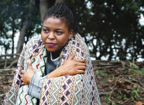 istock Woman with a blanket outdoors 1003582506