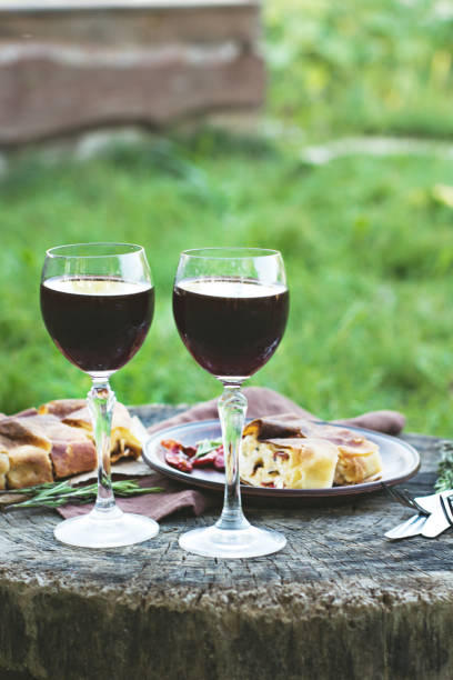 istock Red wine and light snacks, Grapes, wine, cheese, pie. 1003583206