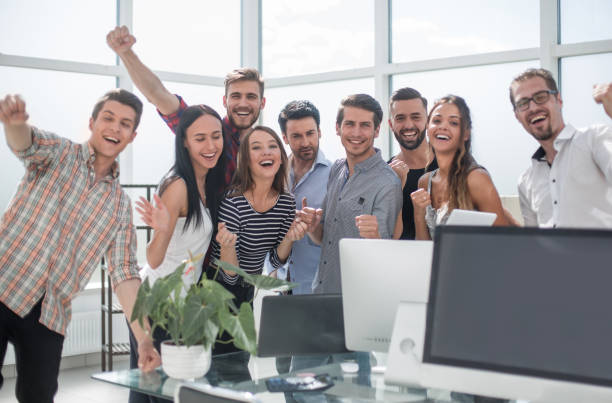 istock happy business team standing in new office 1003583616