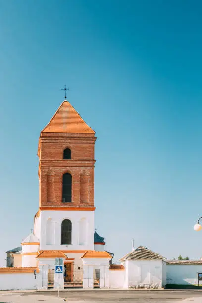 Photo of Mir, Belarus. Saint Nicolas Roman Catholic Church In Mir, Belarus. Famous Landmark In Sunny Summer Day