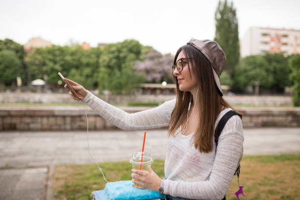 istock girl with a pattern is enjoying the sun beside the river 1003584722