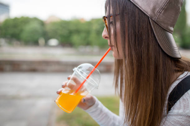 istock girl with a pattern is enjoying the sun beside the river 1003585752