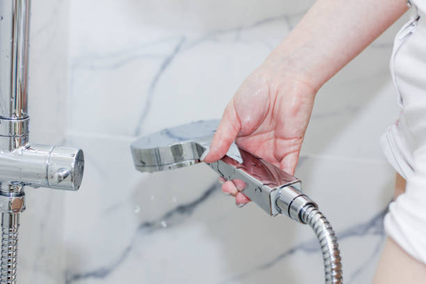 istock water from the shower. chrome plated crane. hot water shut-off. 1003587124