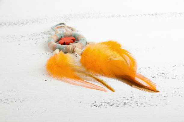 istock Bright dream catcher with an orange cross 1003587536