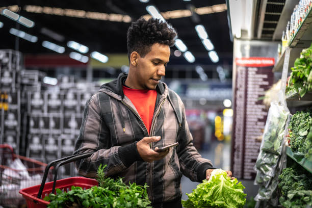 istock Customer Buying Greens on Supermarket 1003587972