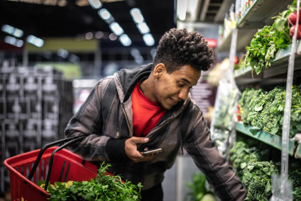 istock Customer Buying Greens on Supermarket 1003587990