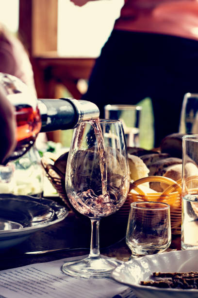 istock Wine is poured into the glass. Wine tasting. 1003589134